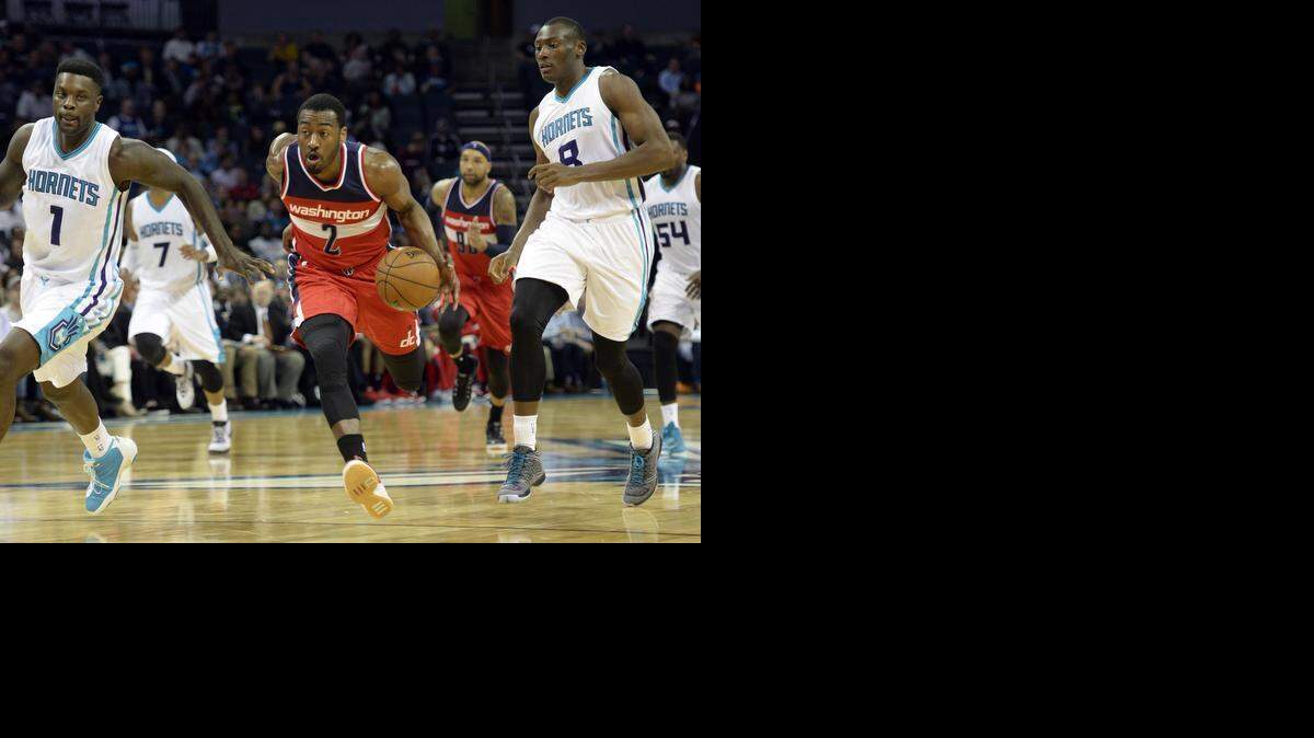 
Washington’s John Wall, shown earlier this month against the Hornets, is averaging just short of a double-double this season (17.4 points, 9.9 assists per game). 



