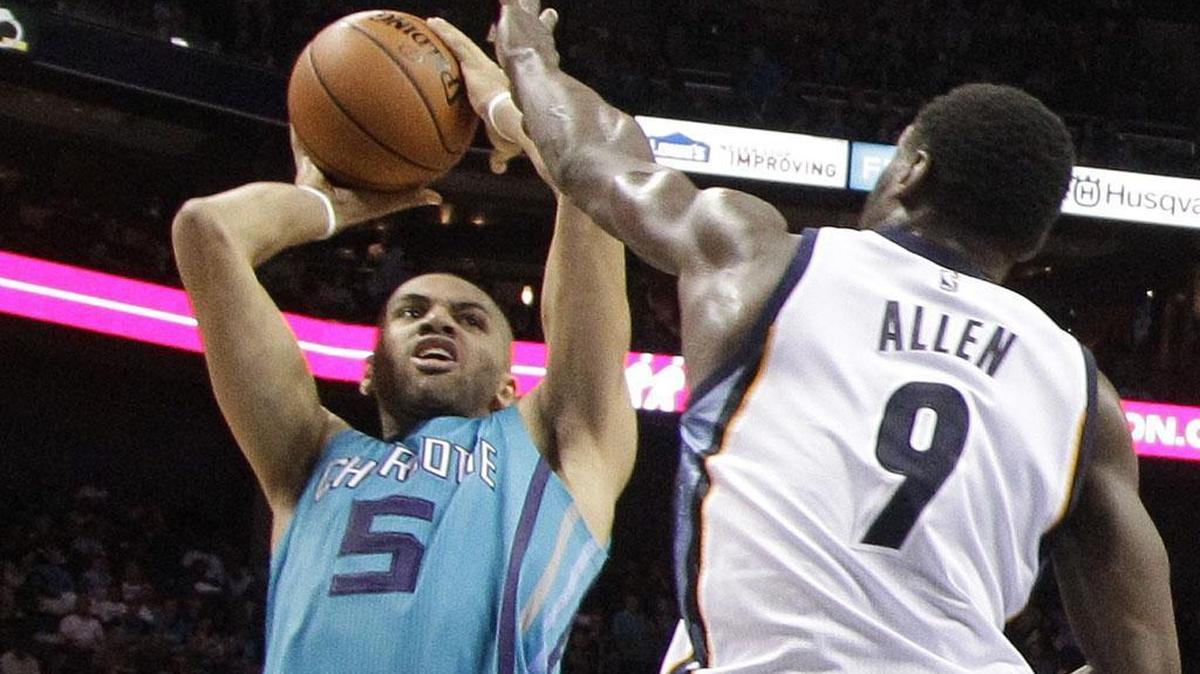 Charlotte Hornets' Nicolas Batum (5) shoots over Memphis Grizzlies' Tony Allen (9) during Saturday’s game. The Hornets won 98-92.