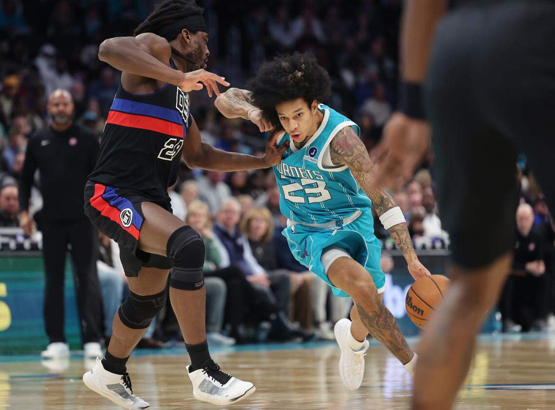 Charlotte Hornets guard Tre Mann drives to the basket as Detroit Pistons defender Isaiah Stewart applies pressure Monday, Feb. 9, 2026. during the first half at Spectrum Center in Charlotte.