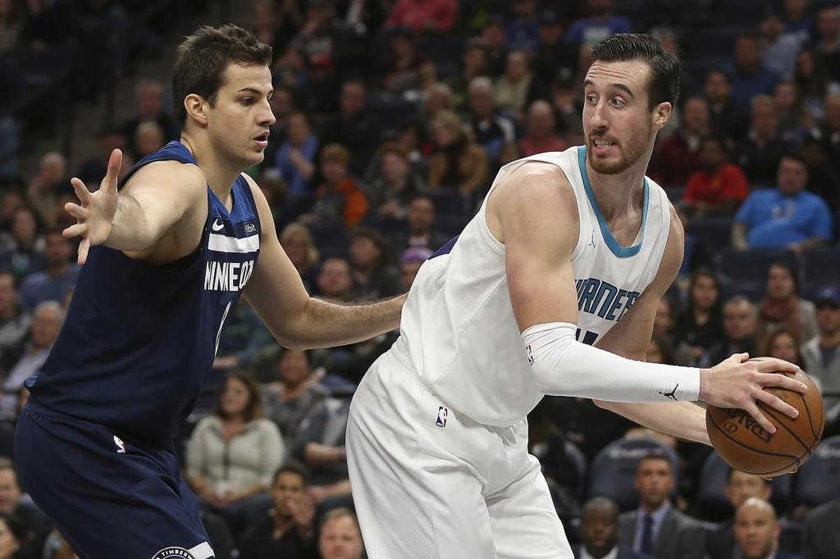 Charlotte Hornets forward Frank Kaminsky III, right, looks back while protecting the ball against Minnesota Timberwolves forward Nemanja Bjelica, left, in the first half of Sunday’s game in Minneapolis. The Wolves won 112-94.