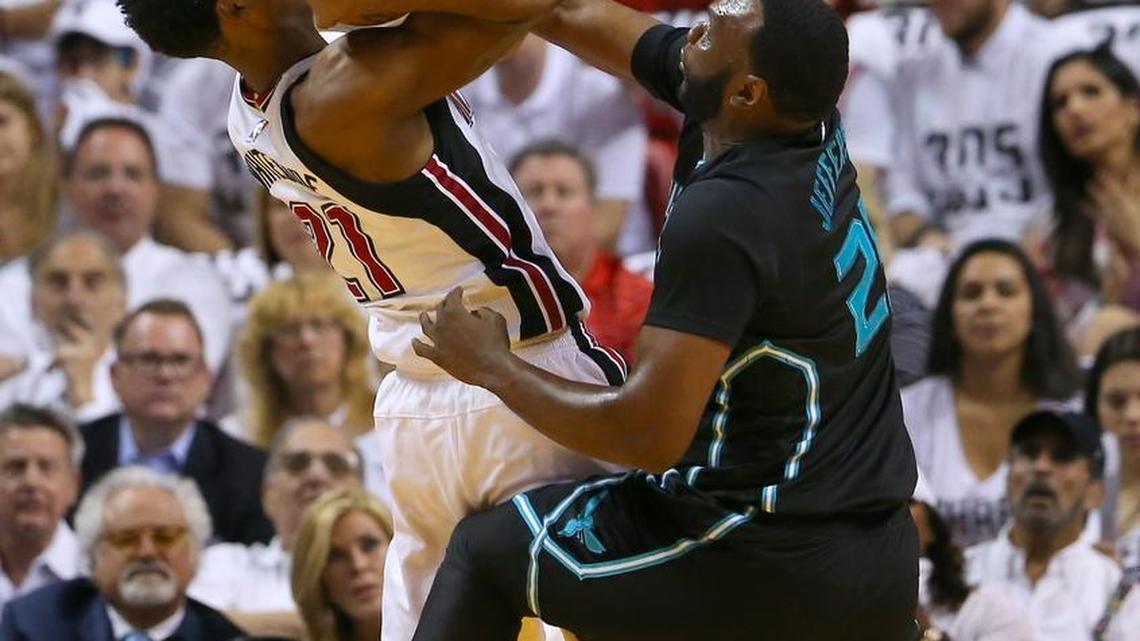 Charlotte Hornets center Al Jefferson blocks a shot against Miami Heat center Hassan Whiteside during the first quarter on Wednesday, April 27, 2016, at AmericanAirlines Arena in Miami.
