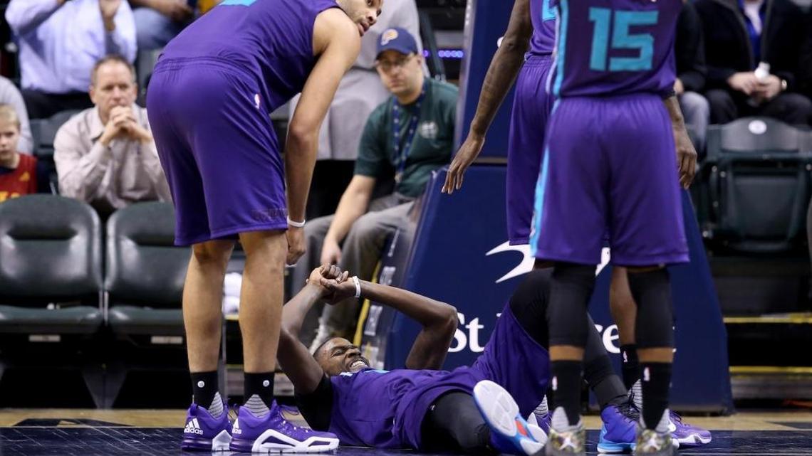 Michael Kidd-Gilchrist grimaces on the floor at Bankers Life Fieldhouse in Indianapolis Wednesday after injuring his right shoulder.