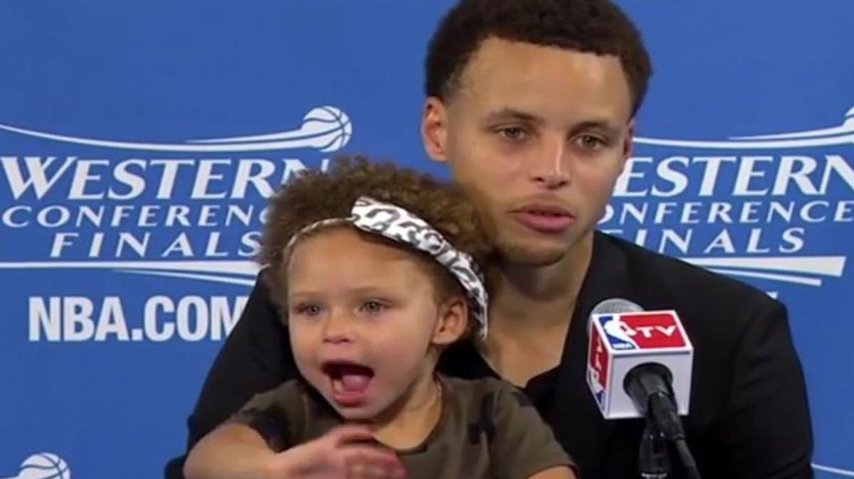 
Stephen Curry’s daughter, Riley, waves to reporters during the Golden State Warriors guard’s news conference Tuesday.
