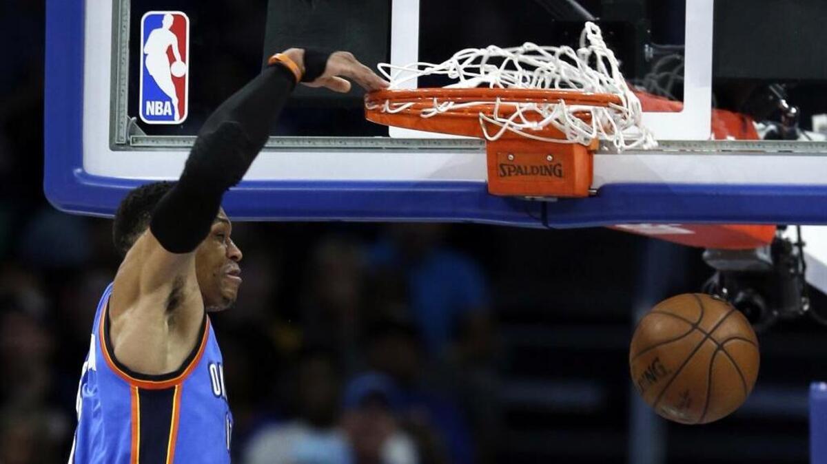 Oklahoma City Thunder guard Russell Westbrook dunks the ball against the Orlando Magic during Wednesday’s overtime win.