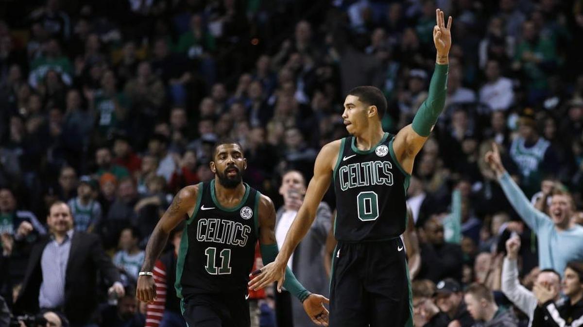 Boston Celtics forward Jayson Tatum (0) will match up with one of Kyrie Irving’s (11) longtime friends Wednesday night, Hornets wing Michael Kidd-Gilchrist.