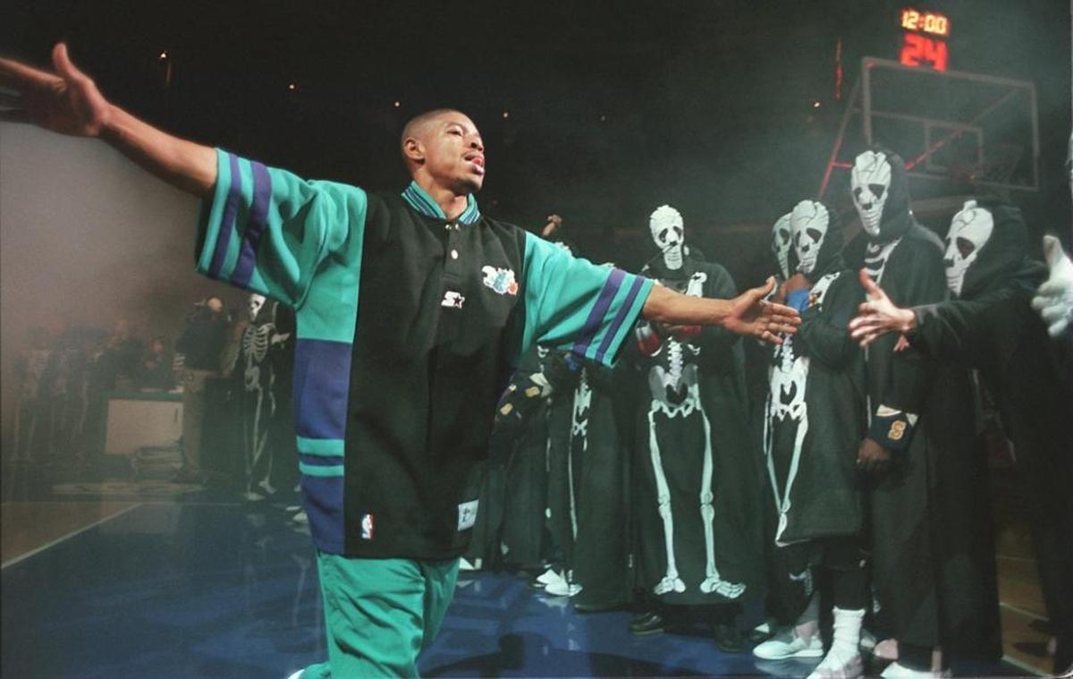 In 1997, greeted by the ghouls on the Charlotte Coliseum court on Halloween, Charlotte Hornet guard Muggsy Bogues runs out onto the court to the cheers of the fans. The team hosted the NY Knicks. Photo By: Jeff Siner/Staff