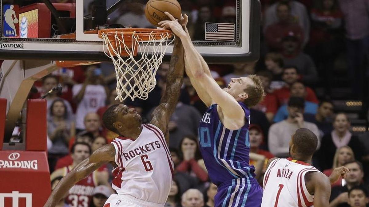 Houston Rockets forward Terrence Jones (6) blocks the dunk attempt by Charlotte Hornets center Cody Zeller (40) late in the second half of an NBA basketball game Monday, Dec. 21, 2015, in Houston. Houston won 102-95.