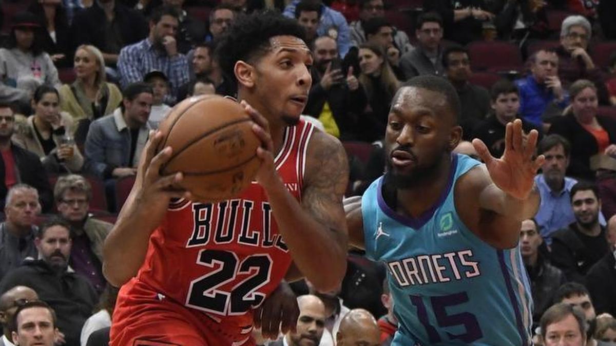 Chicago Bulls guard Cameron Payne, left, is defended by Charlotte Hornets guard Kemba Walker during the first half of Wednesday’s NBA game in Chicago.