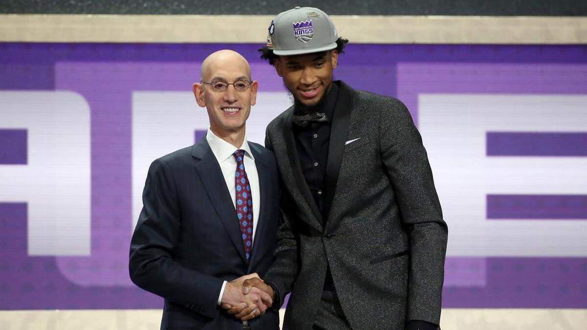 Duke's Marvin Bagley III, right, poses with NBA Commissioner Adam Silver after he was picked second overall by the Sacramento Kings during NBA basketball draft in New York on Thursday.