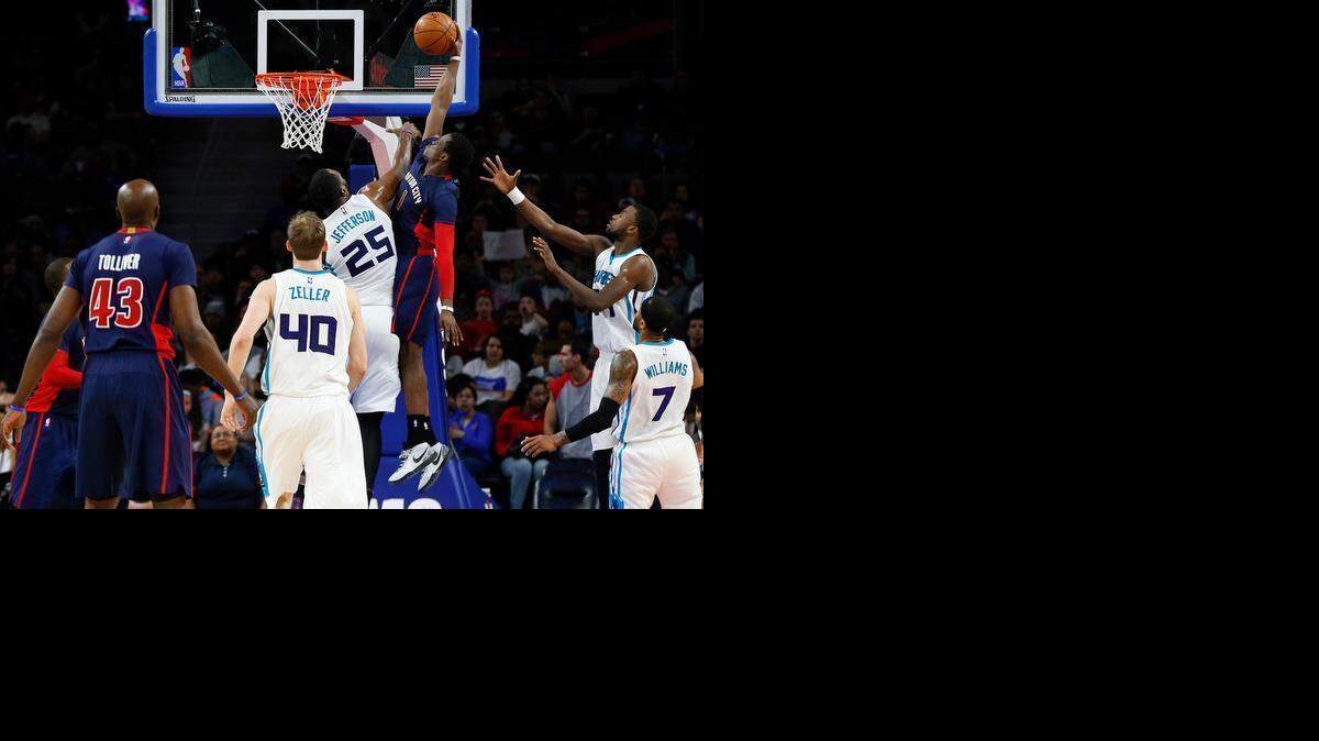 
Detroit Pistons guard Reggie Jackson (1) dunks over Charlotte Hornets center Al Jefferson (25) in the first half of an NBA basketball game in Auburn Hills, Mich., Sunday, March 8, 2015. 
