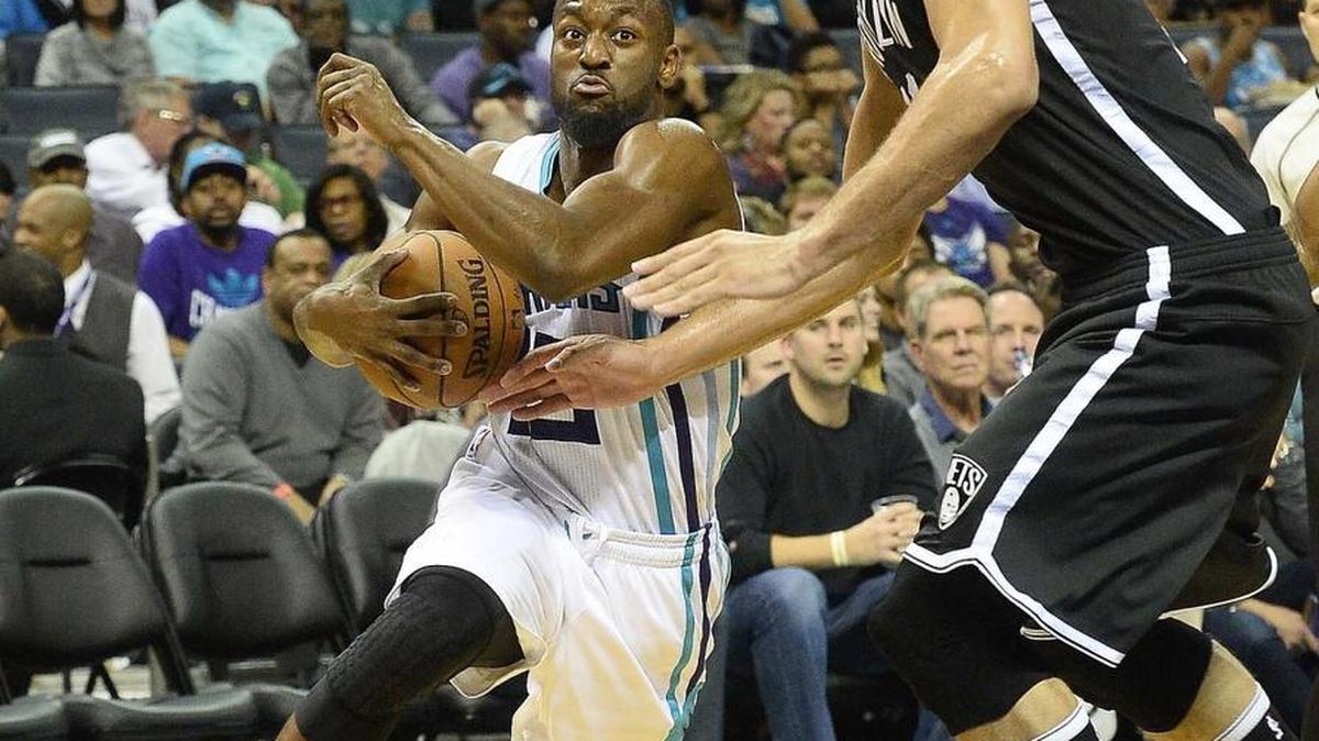 Charlotte Hornets guard Kemba Walker drives to the basket against the Brooklyn Nets’ Brook Lopez during Wednesday night's game at Time Warner Cable Arena.The Charlotte Hornets defeated the Brooklyn Nets, 116-111.