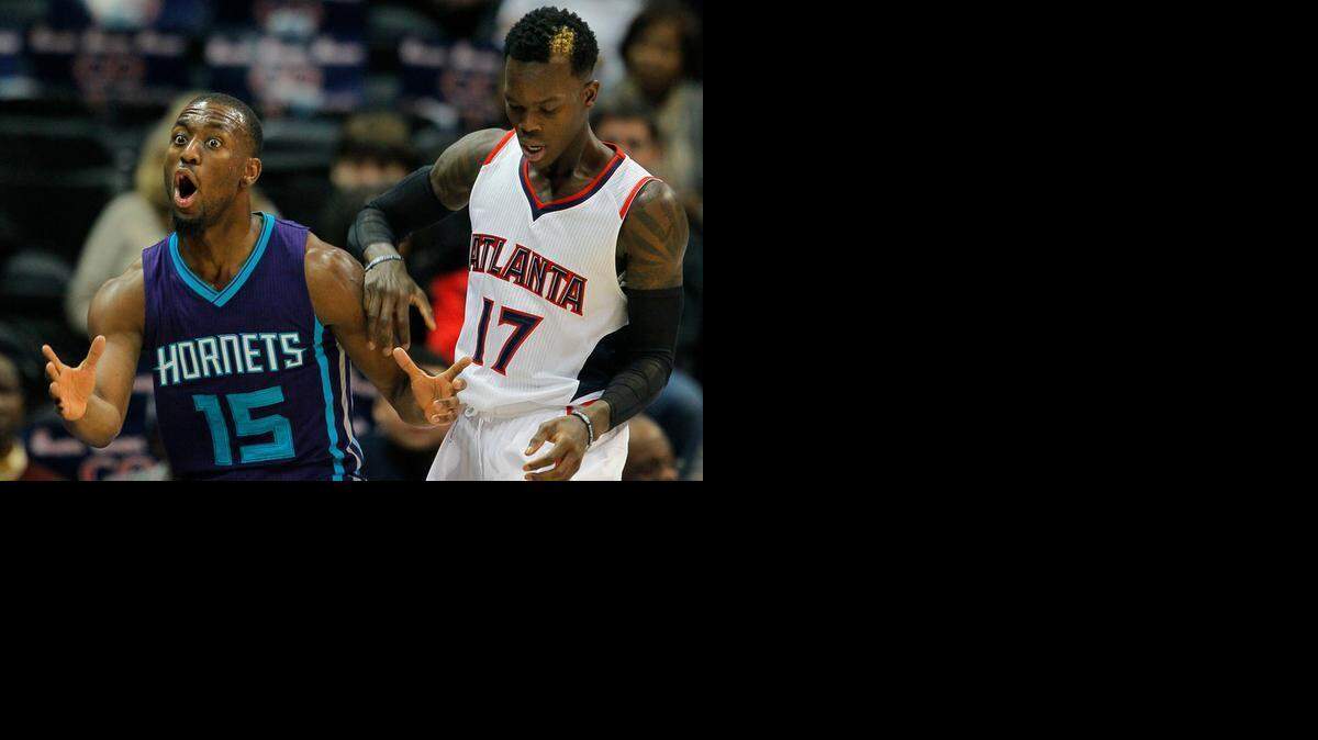 
Charlotte Hornets guard Kemba Walker (15) reacts after not getting the call after battling Atlanta Hawks guard Dennis Schroder (17) in Atlanta, Saturday, Nov. 29, 2014. 
