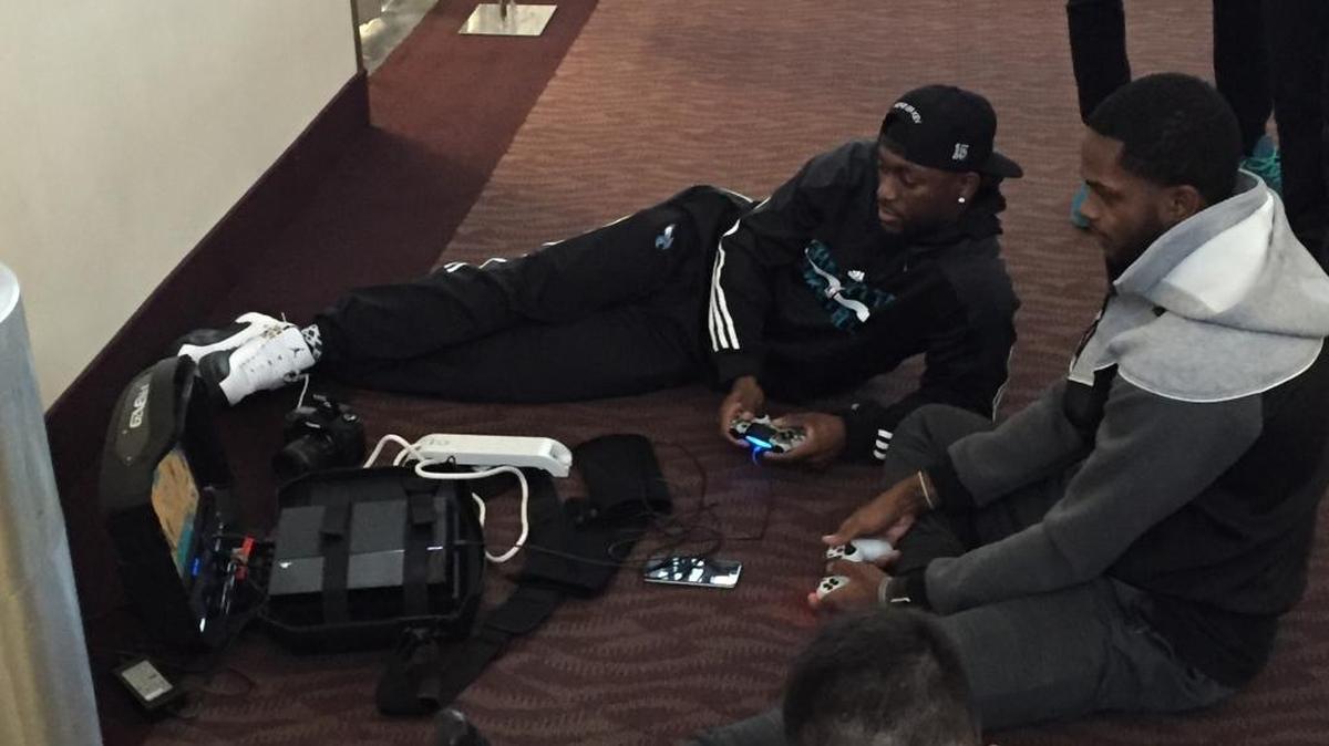 
Charlotte Hornets Kemba Walker (left) and Troy Daniels play a video game during the team’s stopover in Anchorage, Alaska.


