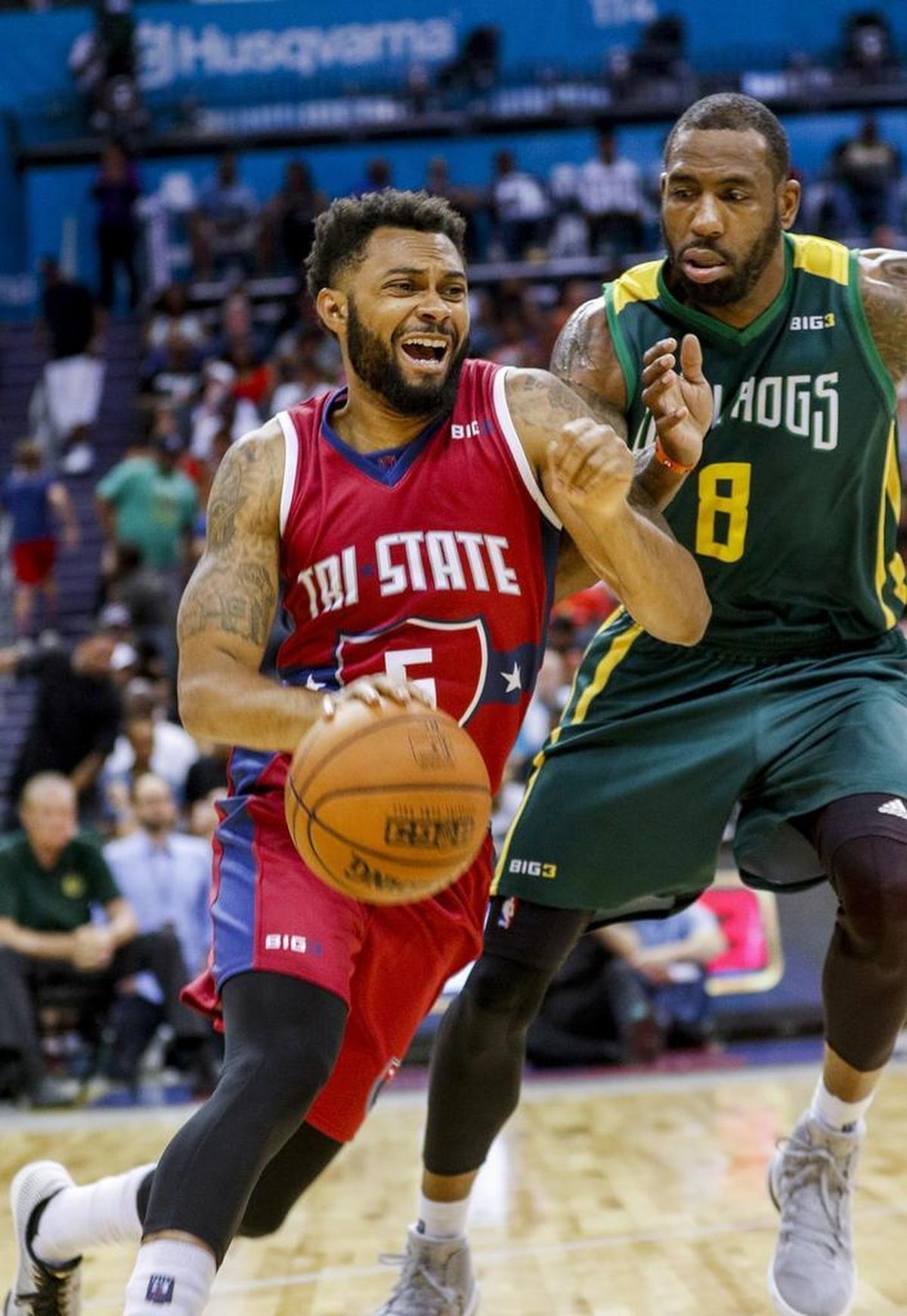Tri-State's Xavier Silas, left, drives around Ball Hogs player Rasual Butler in Sunday’s Big 3 basketball tournament at the Spectrum Center.