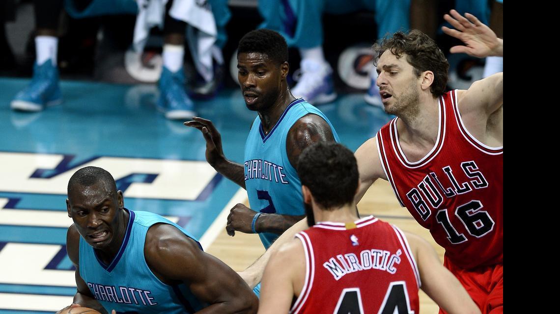 
Former Charlotte Hornets forward/center Bismack Biyombo (8) fights for position under the basket for a shot as Chicago Bulls forward/center Pau Gasol (16) and forward Nikola Mirotic (44) apply defensive pressure on Friday March 13, 2015 at Time Warner Cable Arena in Charlotte, NC. 
