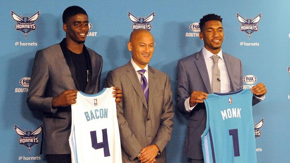 Charlotte Hornets rookies Dwayne Bacon, left, and Malik Monk, right, (surrounding general manager Rich Cho) will get a G-League assignment to the Greensboro Swarm to get some playing time. Bacon is out of the playing rotation and Monk has played minimally of late.