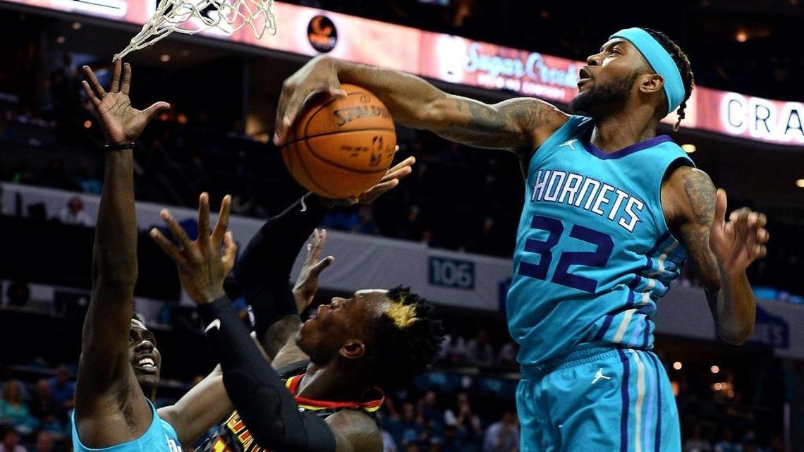 The Charlotte Hornets on Friday assigned guard Julyan Stone, right, to the Greensboro Swarm, the team’s G-League affiliate.