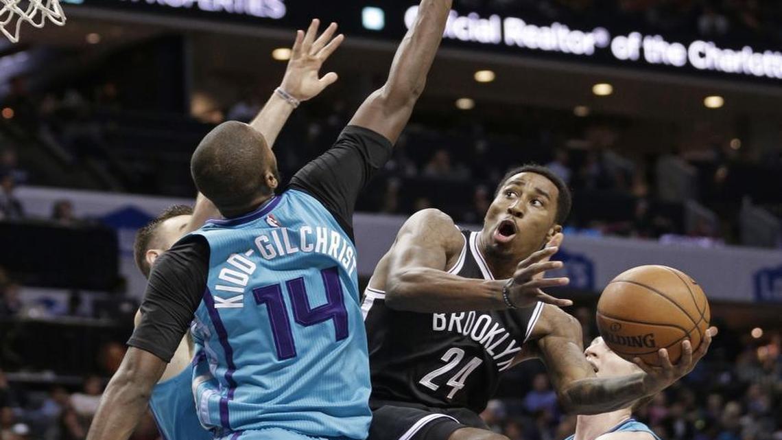 Brooklyn Nets' Rondae Hollis-Jefferson (24) tries to shoot over Charlotte Hornets' Michael Kidd-Gilchrist (14) in the first half of Saturday’s game.