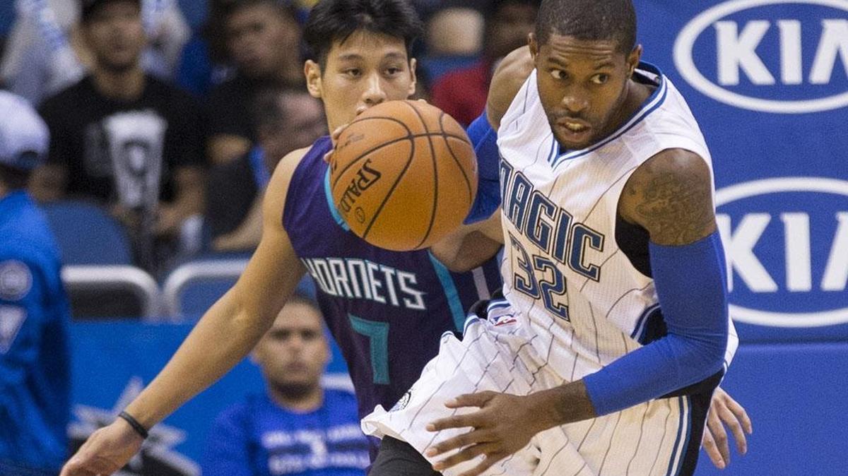 
Orlando Magic guard C.J. Watson (32) steals the ball from Charlotte Hornets guard Jeremy Lin (7) and dribbles up court during the first half of an NBA basketball game in Orlando, Fla., Saturday. 
