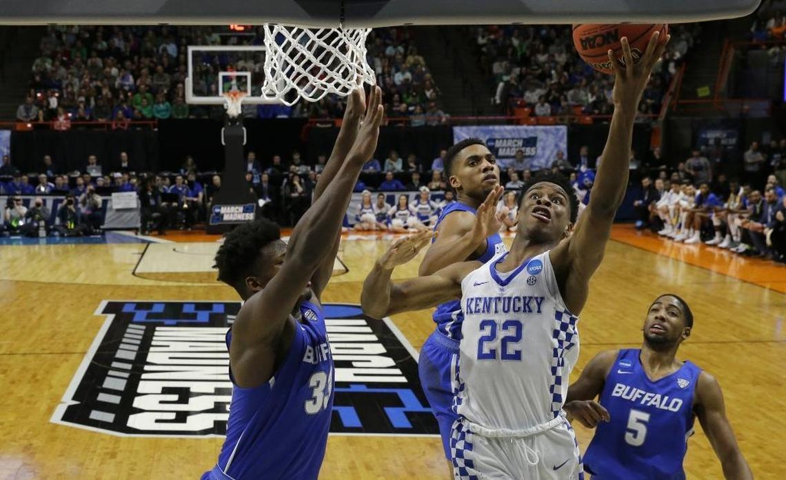 Kentucky guard Shai Gilgeous-Alexander (22) shoots as Buffalo forward Nick Perkins, left, defends during Saturday’s second-round NCAA tournament game in Boise, Idaho.