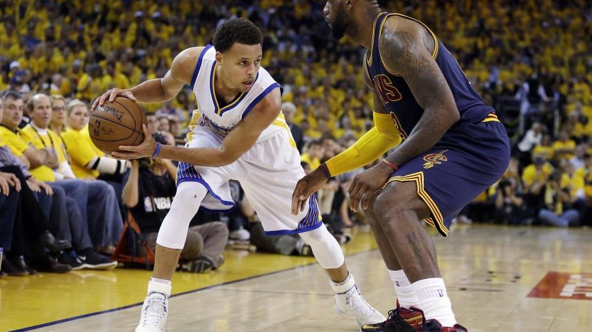 Golden State guard Stephen Curry, left, is defended by Cleveland forward LeBron James during last season’s NBA Finals. Reigning champion Golden State will try again to advance from the Western Conference.