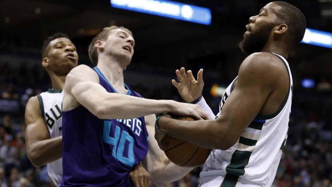 Charlotte Hornets' Cody Zeller (40) and Milwaukee Bucks' Greg Monroe battle for a rebound during the first half of an NBA basketball game Saturday in Milwaukee.