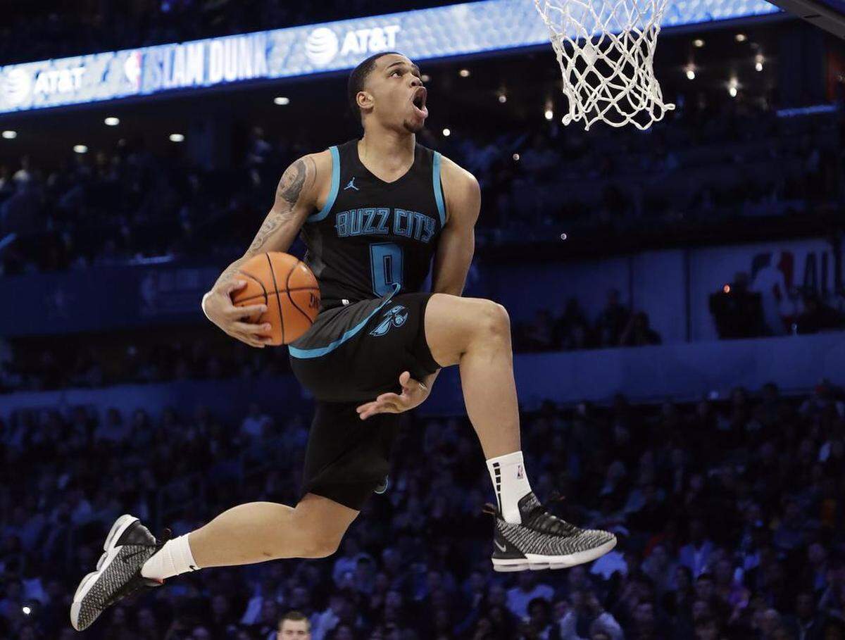 Charlotte Hornets rookie Miles Bridges soars to the basket during the NBA All-Star Slam Dunk contest at the Spectrum Center on Saturday.