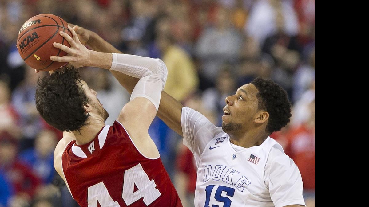 
Duke's Jahlil Okafor. blocking a shot by Wisconsin's Frank Kaminsky in the NCAA championship game, and Kentucky’s Karl-Anthony Towns will likely be the top two choices in the NBA draft.
