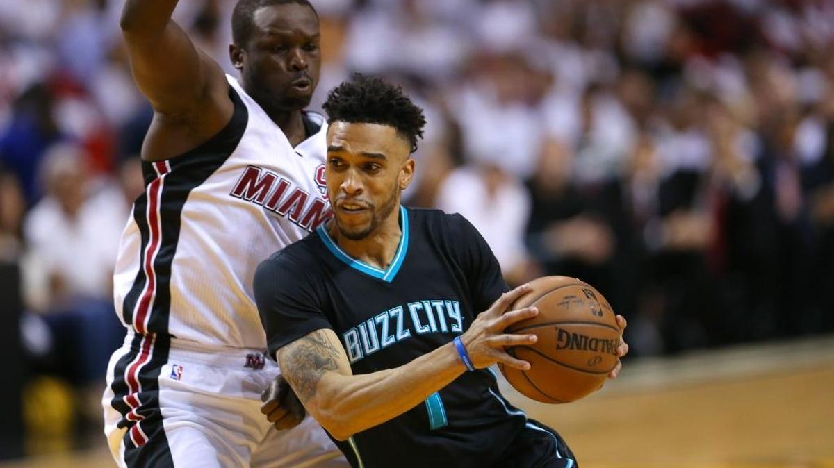 Charlotte Hornets guard Courtney Lee drives against Miami Heat forward Luol Deng during the first quarter of Game 5 of the first round of the 2016 NBA Eastern Conference Playoffs at AmericanAirlines Arena in Miami on Wednesday, April 27, 2016.