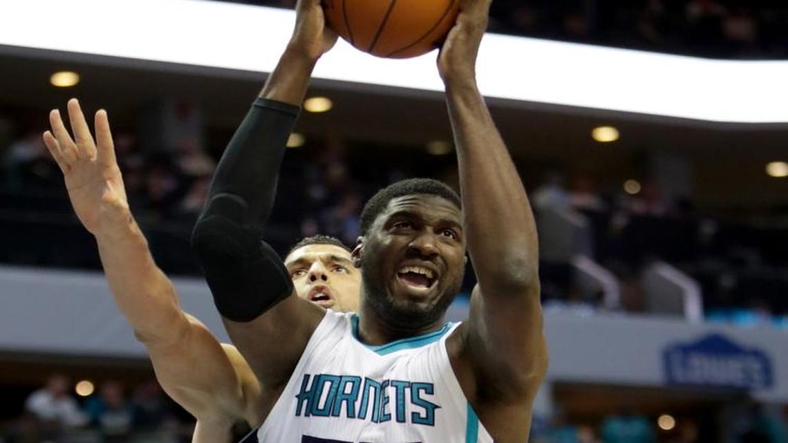 Roy Hibbert (55) of the Charlotte Hornets grabs a rebound over Salah Mejri (50) of the Dallas Mavericks Thursday.