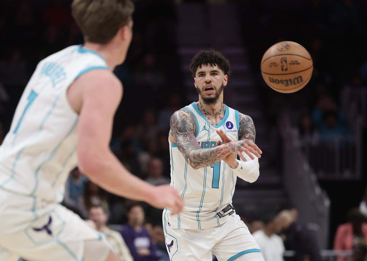 Charlotte Hornets guard LaMelo Ball passes the ball to Kon Knueppel during the second half of Tuesday’s game against the Sacramento Kings.