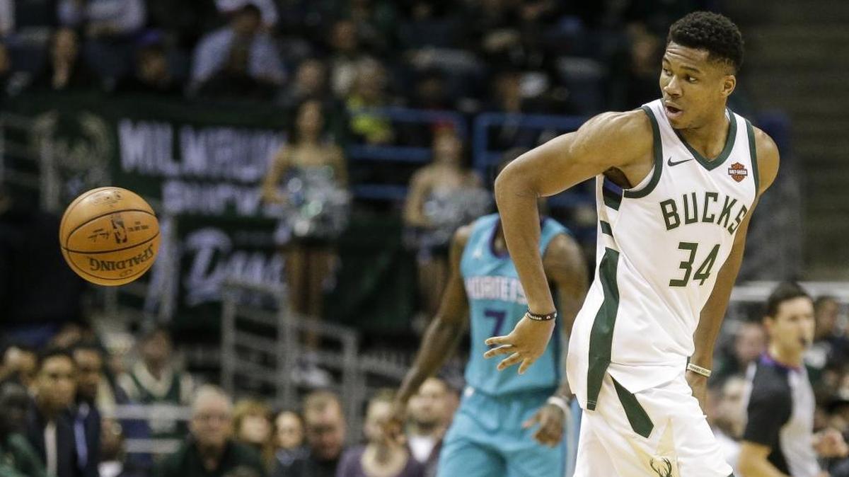 Milwaukee Bucks' Giannis Antetokounmpo (34) has rare perimeter skills for a player of his size, such as this behind-the-back pass he threw in a victory over the Charlotte Hornets in Milwaukee on Oct. 23.