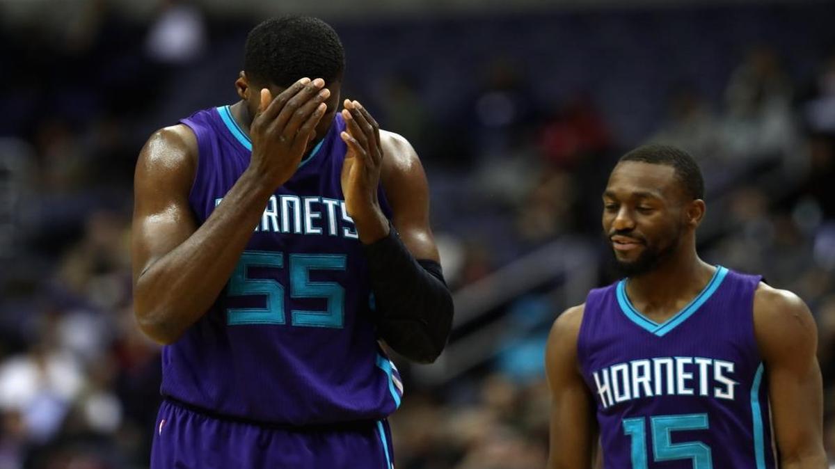 Charlotte Hornets Roy Hibbert, left, and Kemba Walker talk Wednesday at Washington. The Hornets are now 0-3 on this five-game road trip.