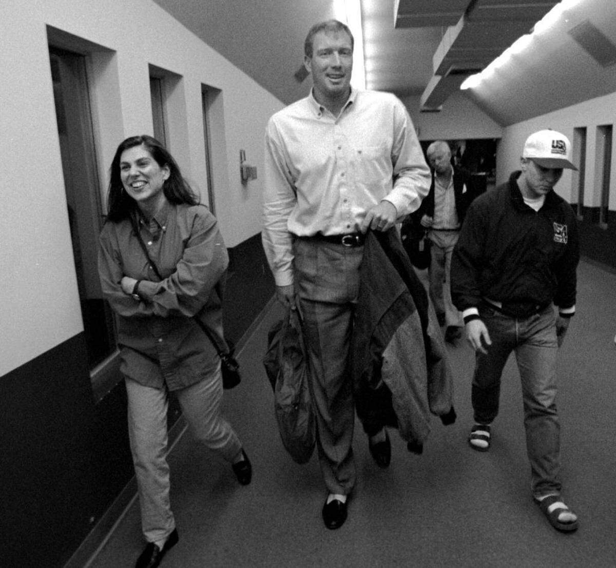 Former Charlotte Hornet Tim Kempton, center, seen here in a February 1994 photo, played for the team in its inaugural 1988-89 season. Kempton’s son, also named Tim, worked out for the team Sunday ahead of the NBA draft.