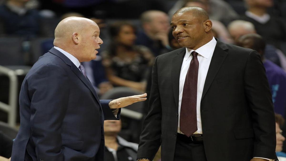 Charlotte Hornets coach Steve Clifford, left, talks with Los Angeles Clippers coach Doc Rivers before Saturday night’s game at the Spectrum Center.