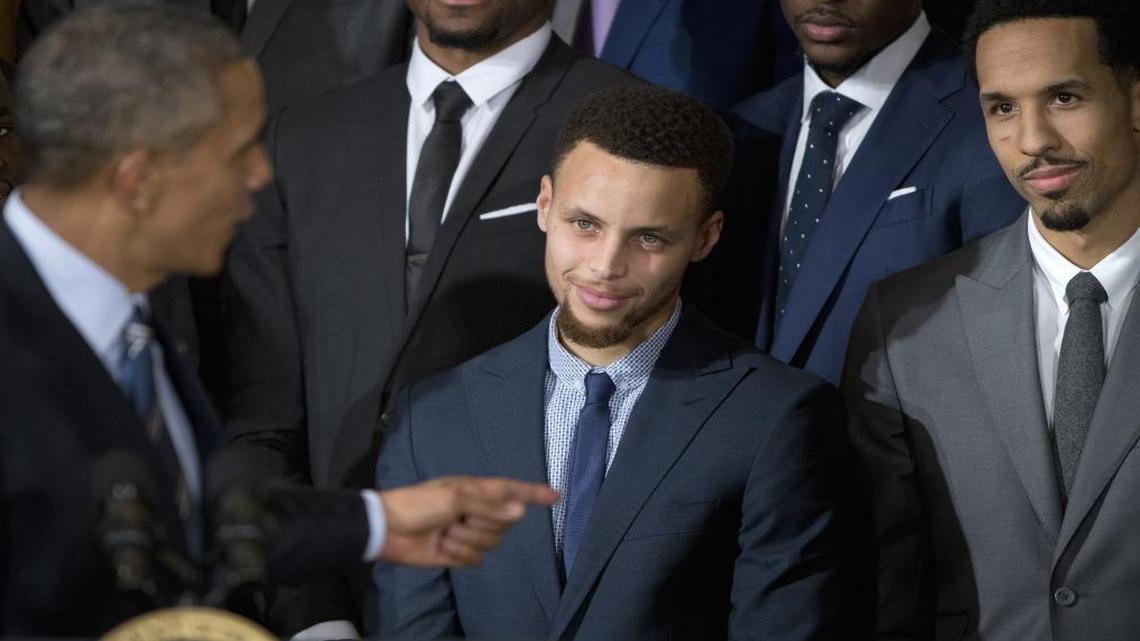 The Golden State Warriors, including star Stephen Curry, center, visited the White House two years ago to celebrate their NBA championship with then-President Barack Obama (left).