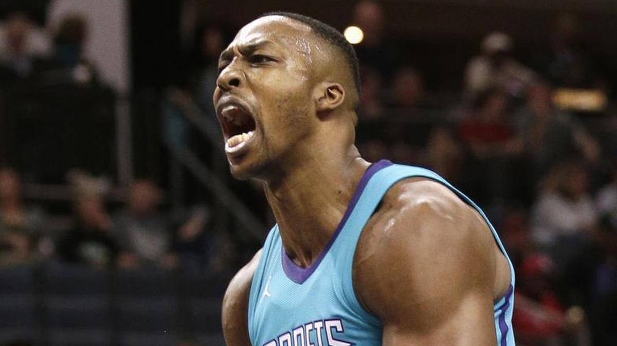 Charlotte Hornets' Dwight Howard reacts after a dunk against the Houston Rockets during the first half of Friday’s game at the Spectrum Center. The Hornets got another big game from center Howard, with 19 points and 16 rebounds, in a 109-93 loss.