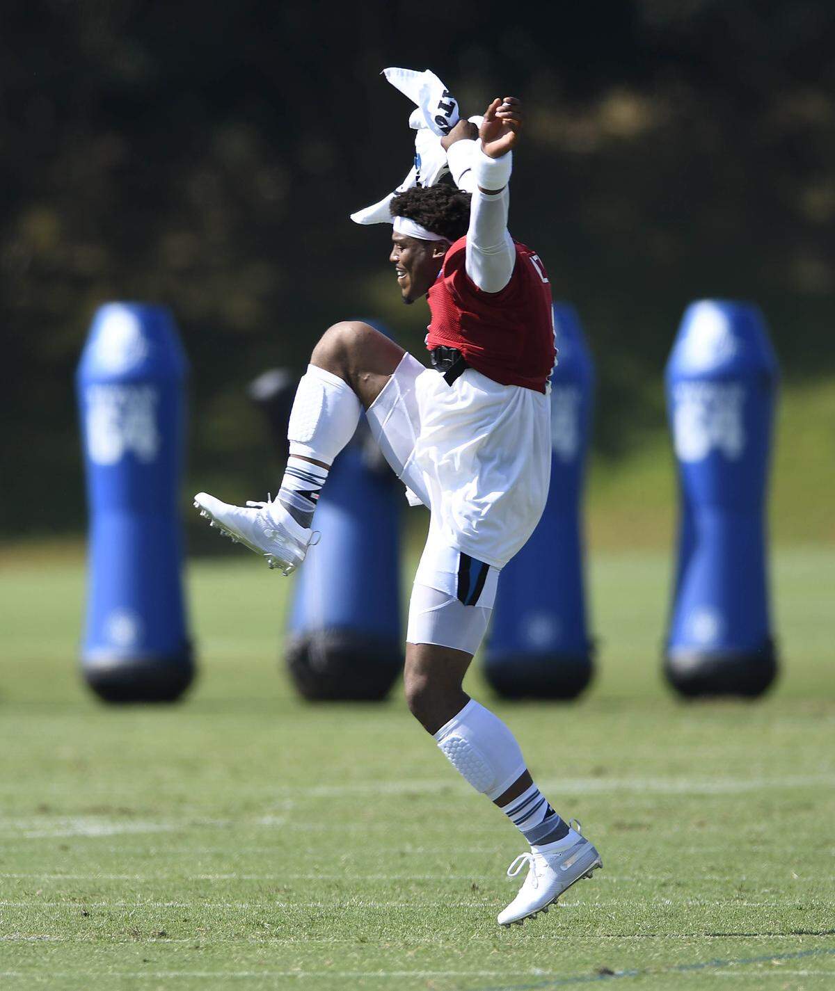 Carolina Panthers quarterback Cam Newton (1) dances after playfully trying to get an Atlanta Falcons fan removed from the fan section during practice at Training Camp 2018 at Wofford College in Spartanburg, S.C., on Saturday, July 28, 2018.