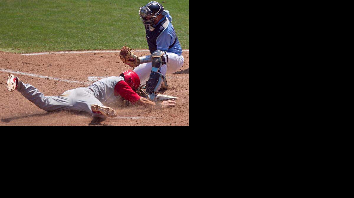 
UNC catcher Korey Dunbar (43) tags out N.C. State's Trea Turner (8) at home plate, after teammate Jake Fincher (30) struck out in the fifth inning, and Turner attempted to steal home during the ACC Baseball Championship on Tuesday May 20, 2014 in Greensboro, N.C.
