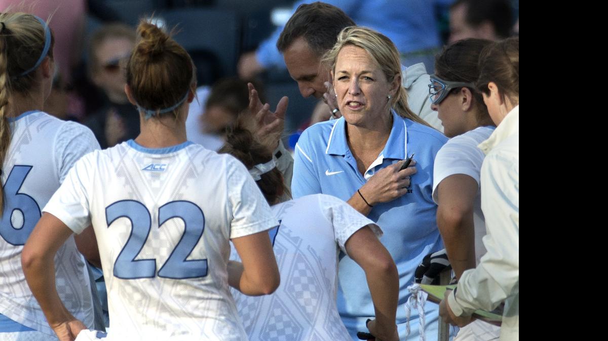
North Carolina's head coach Jenny Levy talks things over with her team during the second half of the semifinals in the NCAA Division I women's lacrosse tournament againstDuke, Friday, May 22, 2015, in Chester, Pa. North Carolina won 16-7. 
