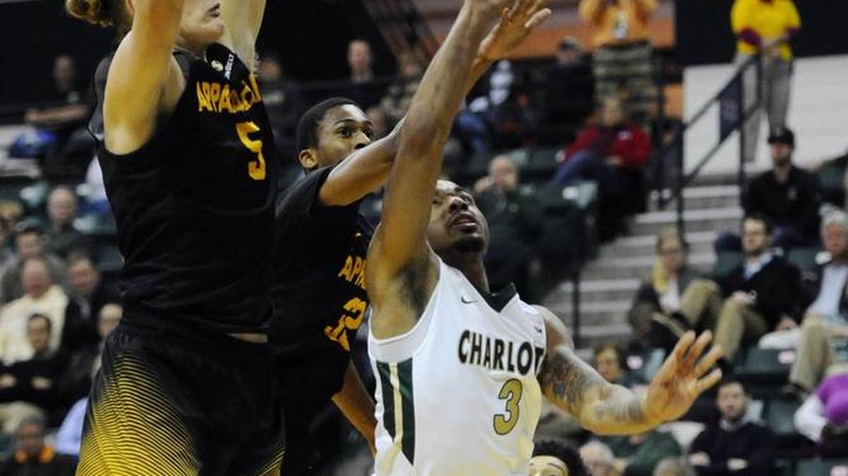Charlotte 49ers guard Jon Davis (3) drives in past Appalachian State forward Griffin Kinney (5) during the first half of Monday night’s game at Halton Arena.