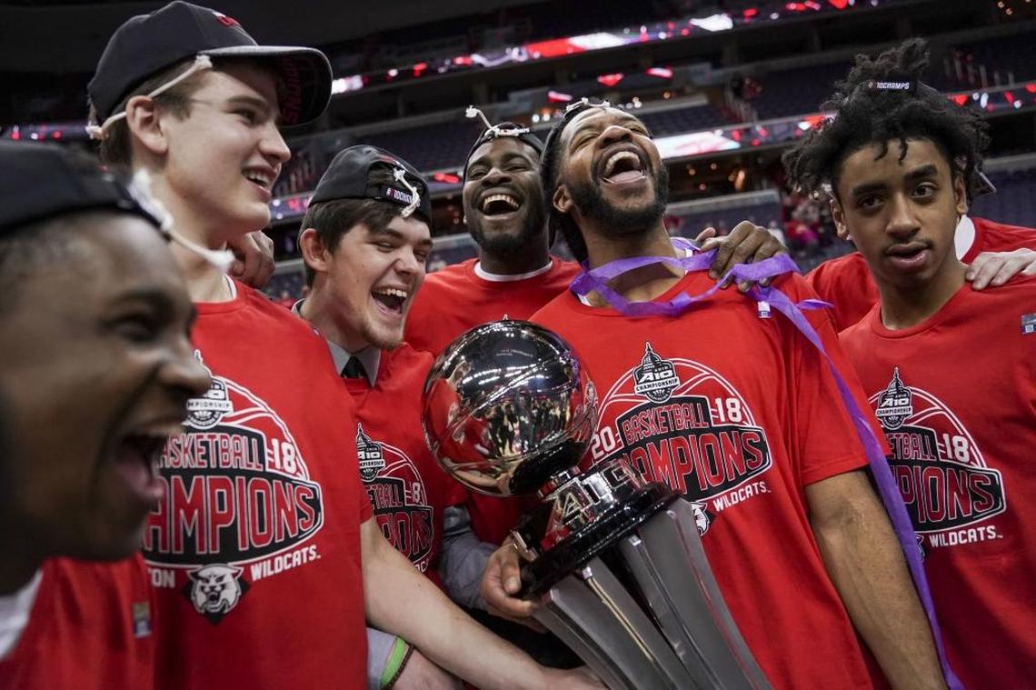 Davidson teammates celebrate after Sunday’s Atlantic 10 Conference tournament championship game.