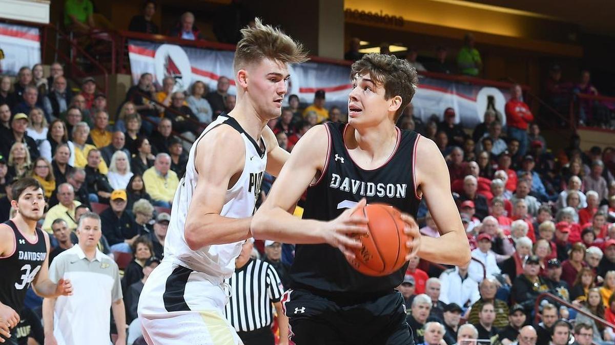 Luka Brajkovic, pictured Friday against Purdue’s Matt Haarms in the Charleston Classic, scored 17 points and grabbed 11 rebounds in Sunday’s third-place game against Northeastern. Brajkovic and the Wildcats won 71-59.