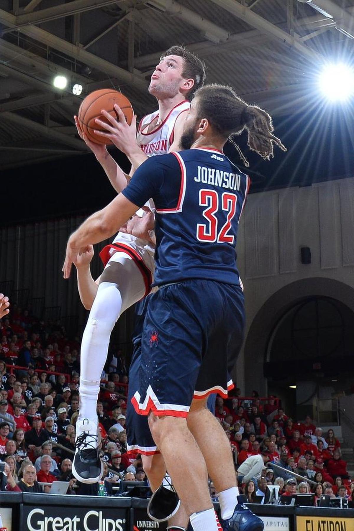 Davidson’s Jon Axel Gudmundsson, left, is fouled by Richmond's Julius Johnson late in the second half of Saturday’s Atlantic 10 men’s basketball game against Richmond. Gudmundsson finished with 12 points, 11 rebounds and seven assists in the Wildcats’ 75-62 victory.