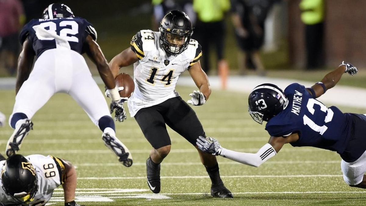 Appalachian State senior Marcus Cox (14) has gained a school-record 4,820 yards rushing. In the Mountaineers’ new two-back formation, he is paired with sophomore Jalin Moore, who leads the Sun Belt Conference this season with 1,256 yards.