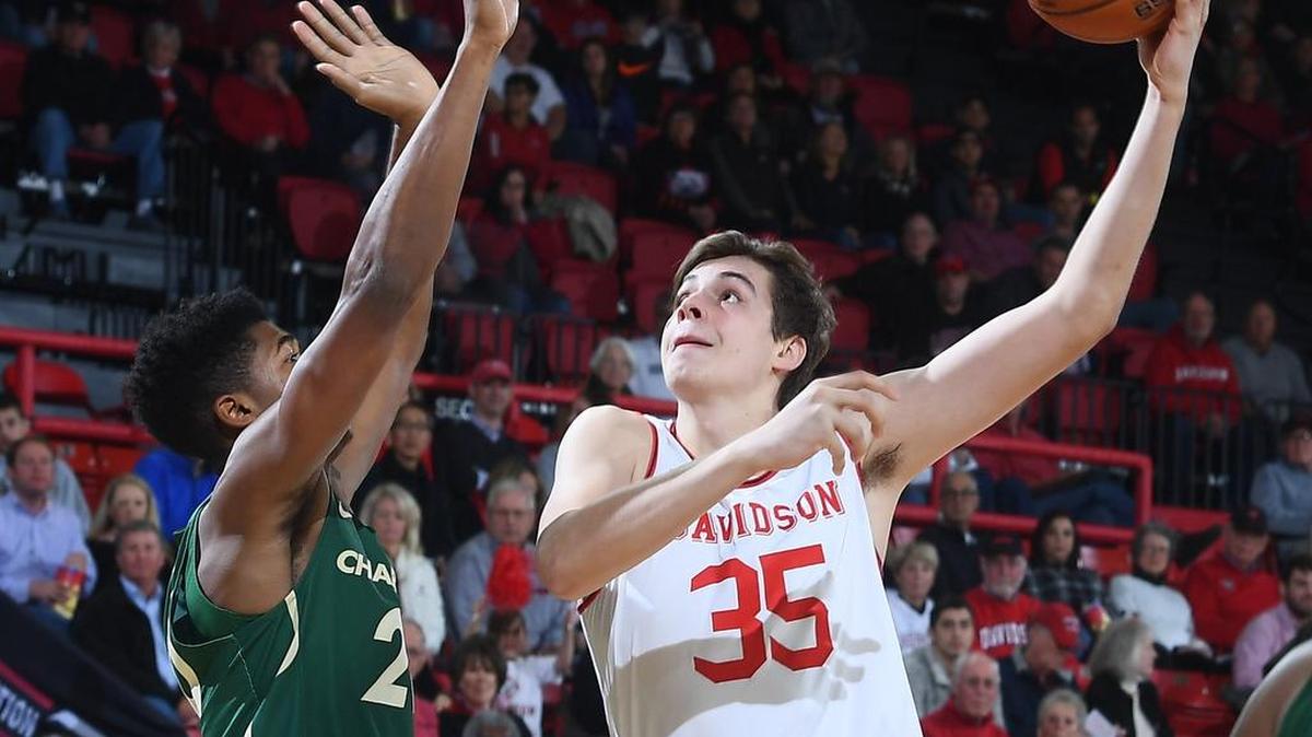 Luka Brajkovic (35) of Davidson scores over Charlotte’s Dravon Mangum (20) early in the first half of non-conference basketball at Belk Arena on Tuesday, November 27, 2018, in Davidson, North Carolina.