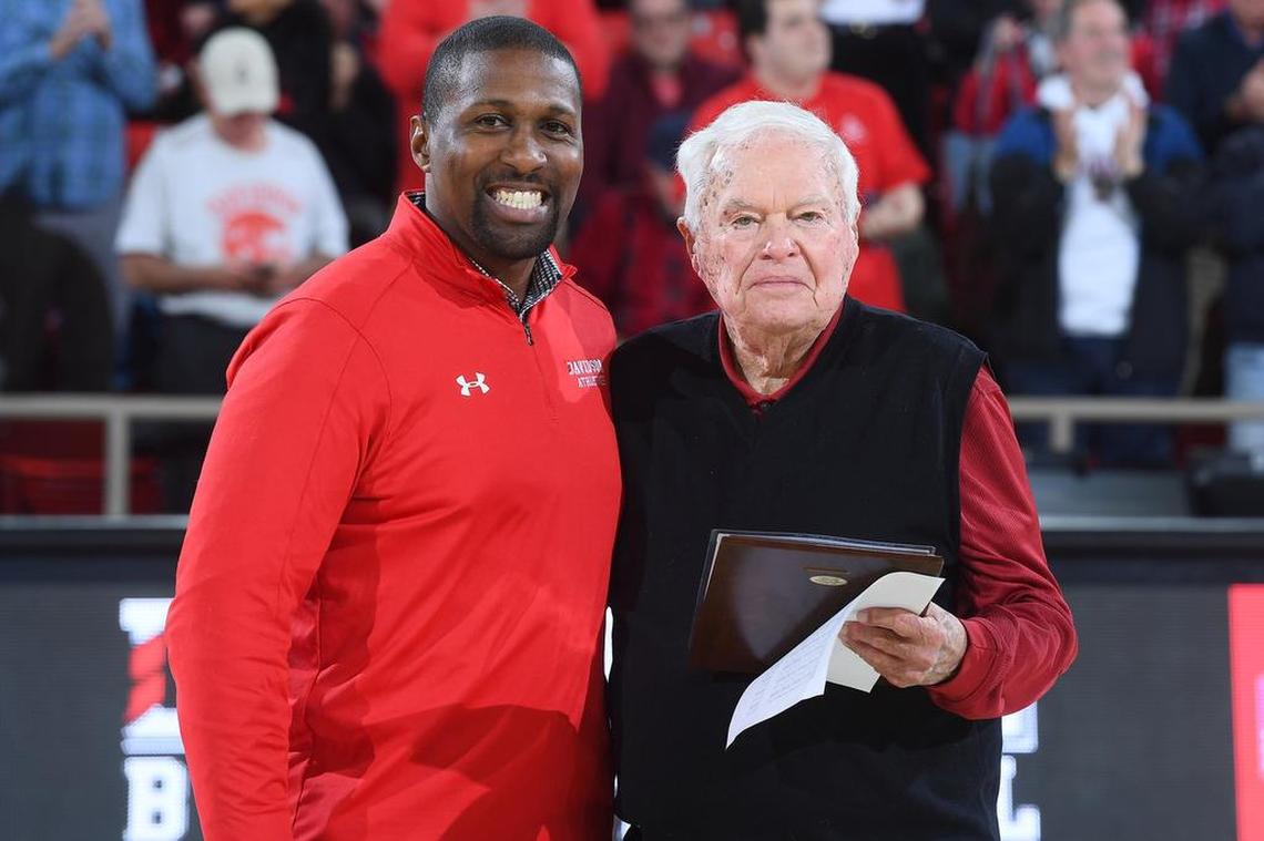 In November, new Davidson athletics director Chris Clunie, left, recognized John Kilgo on his retirement after 18 years as the basketball team’s radio announcer.