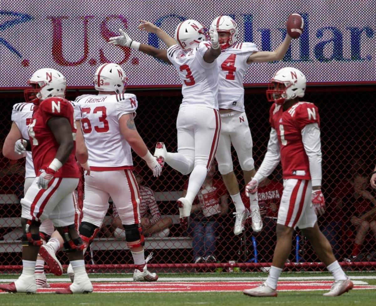 Nebraska quarterback Tristan Gebbia (4) celebrates his touchdown with wide receiver Keyshawn Johnson Jr. (3) during the Red-White spring game in April.