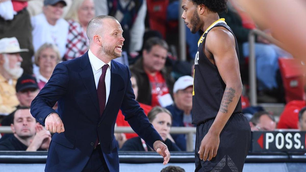 Winthrop head coach Pat Kelsey talks with Charles Falden (11) early in second half non-conference basketball action against Davidson at Belk Arena on Tuesday, December 04, 2018 in Davidson, North Carolina. Davidson won 99-81.