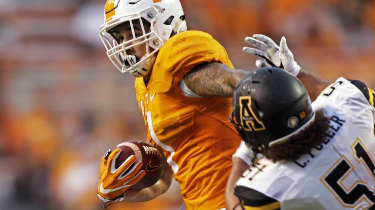Tennessee running back Jalen Hurd escapes Appalachian State defensive lineman Caleb Fuller (51) during the first half of Thursday’s game in Knoxville, Tenn. Tennessee won 20-13 in overtime.